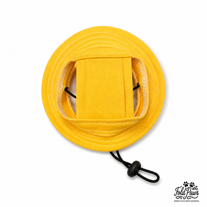 Yellow Fold Paws cat bucket hat with adjustable chin strap on white background