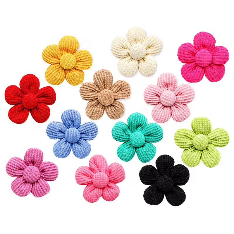 Dog and cat wearing Fold Paws flower hair bows for pet photos